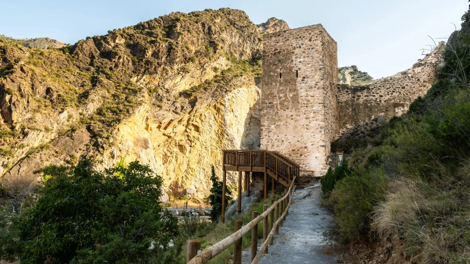 The square stone tower of Arnedillo castle on a rocky ridge, La Rioja, Spain