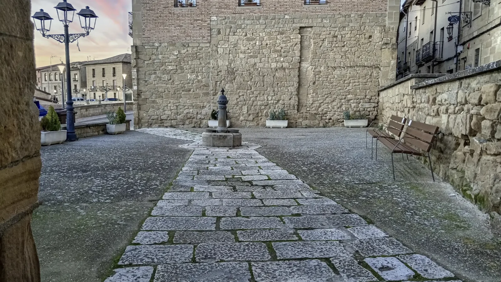 An empty paved square by the old wall in Briones, La Rioja, Spain