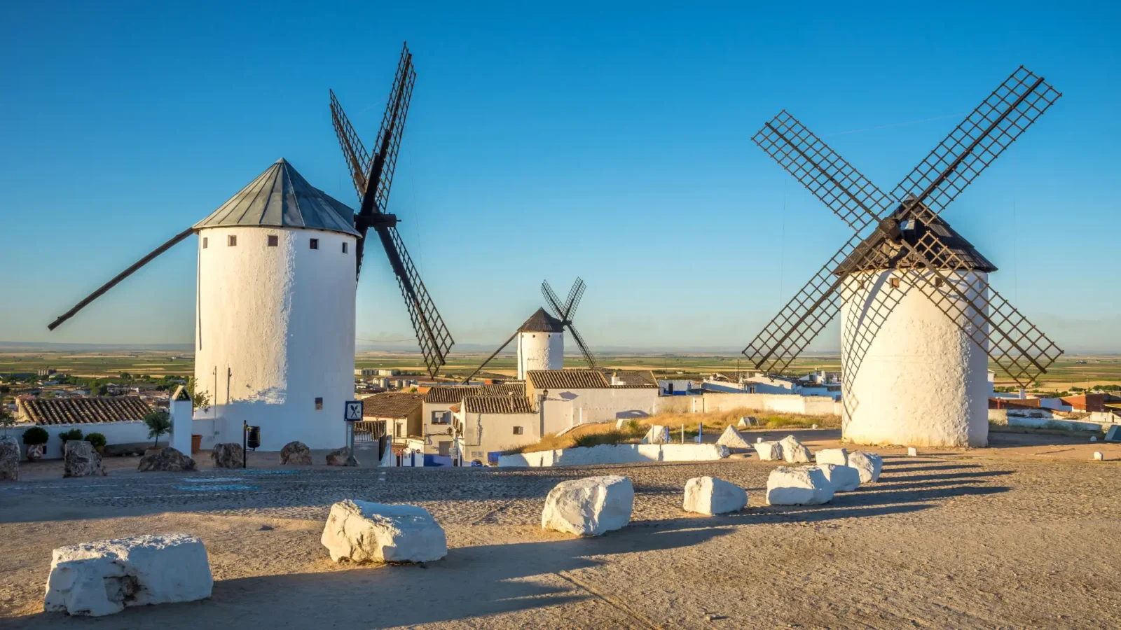 Windmills on the Sierra de los Molinos at golden hour in Campo de Criptana, Ciudad Real, Spain