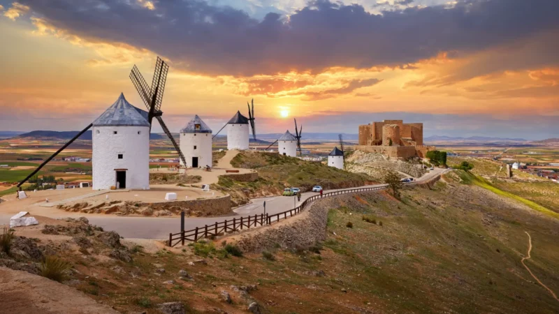 The windmills of Consuegra on the ridge at sunset, Castilla-La Mancha, Spain