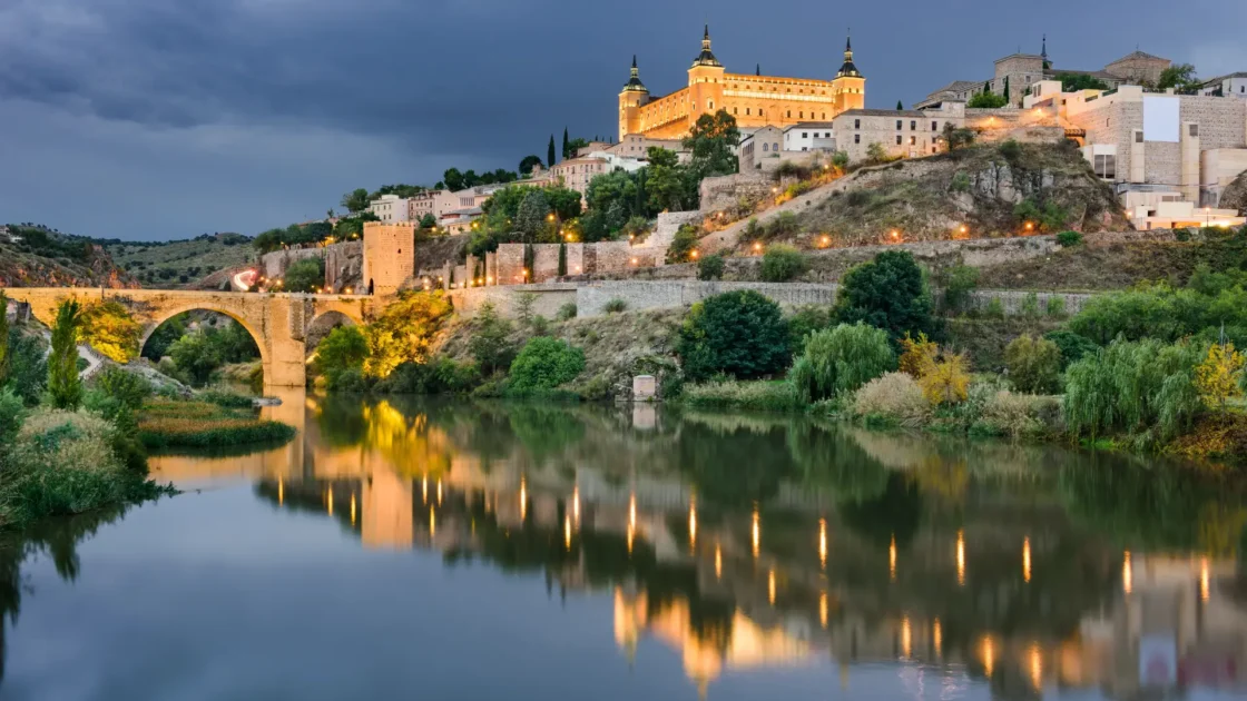 Toledo and the Alcázar above the River Tagus at dusk, Castilla-La Mancha, Spain