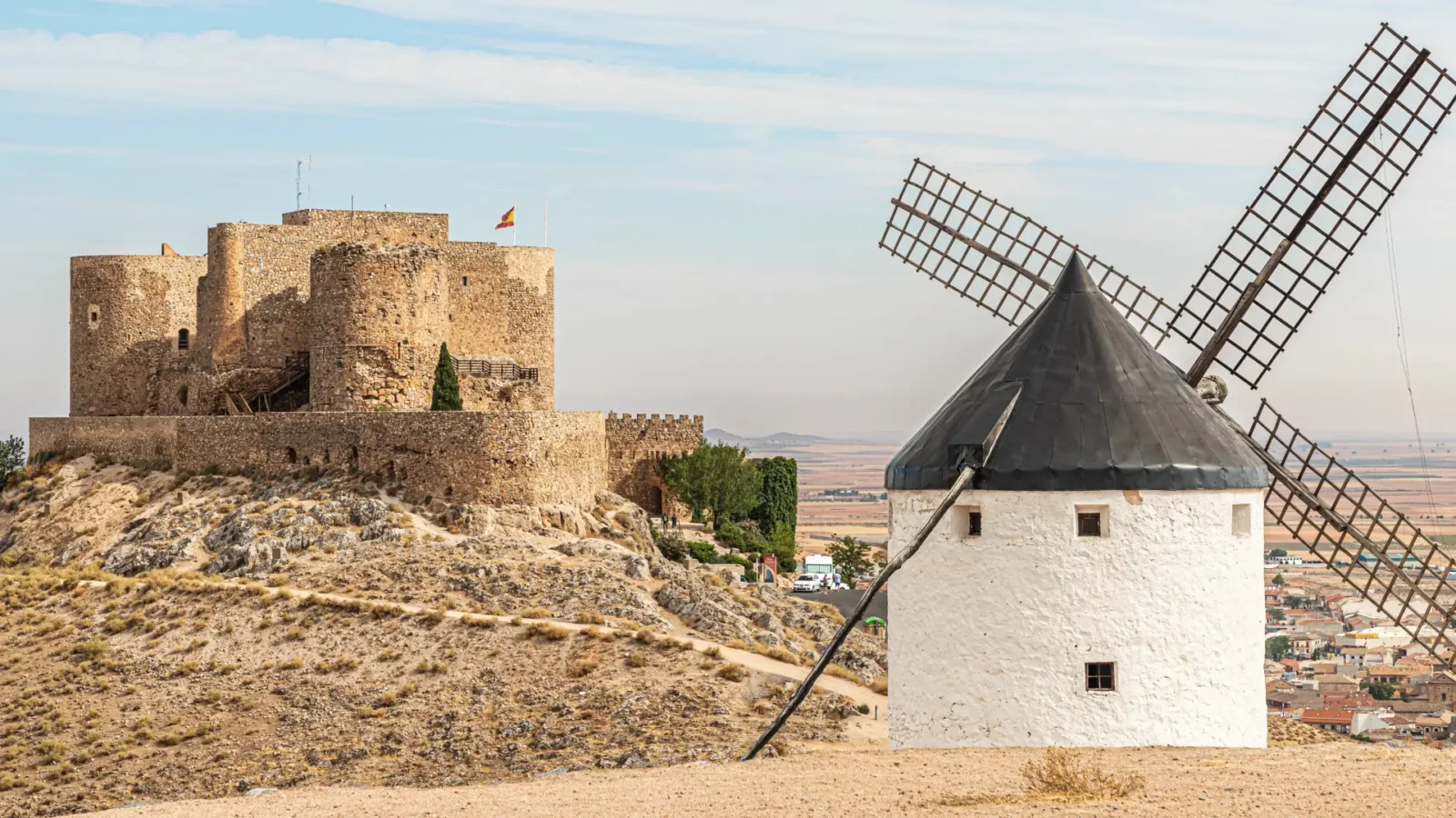 The Castle of La Muela and a windmill in Consuegra, Castilla-La Mancha, Spain