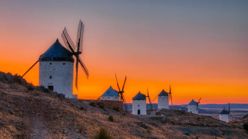 The twelve windmills of the Cerro Calderico at sunset in Consuegra, Castilla-La Mancha, Spain