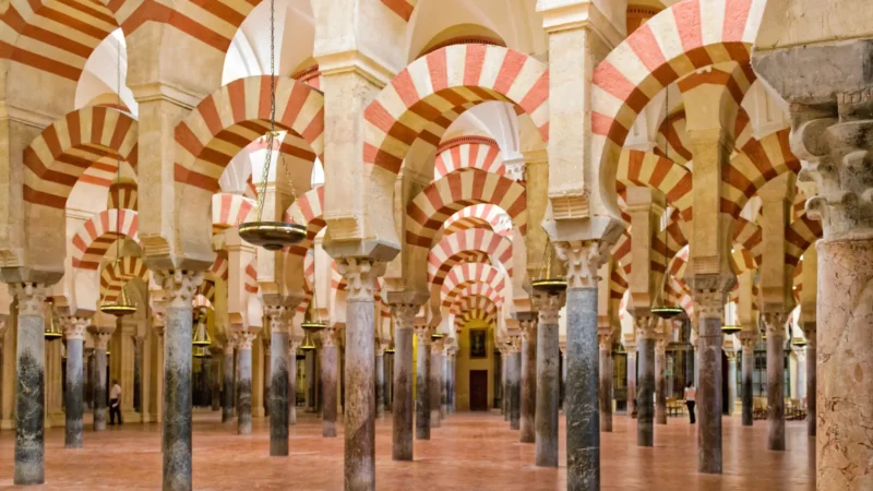 The red-and-white arches inside the Mezquita mosque-cathedral, Córdoba, Spain