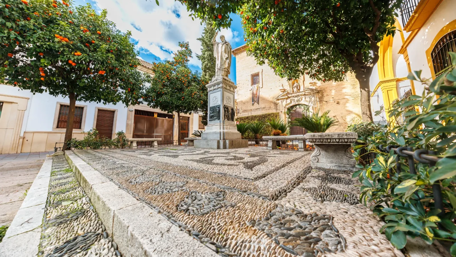 An orange-tree square with a pebbled floor in old Córdoba, Andalucía, Spain