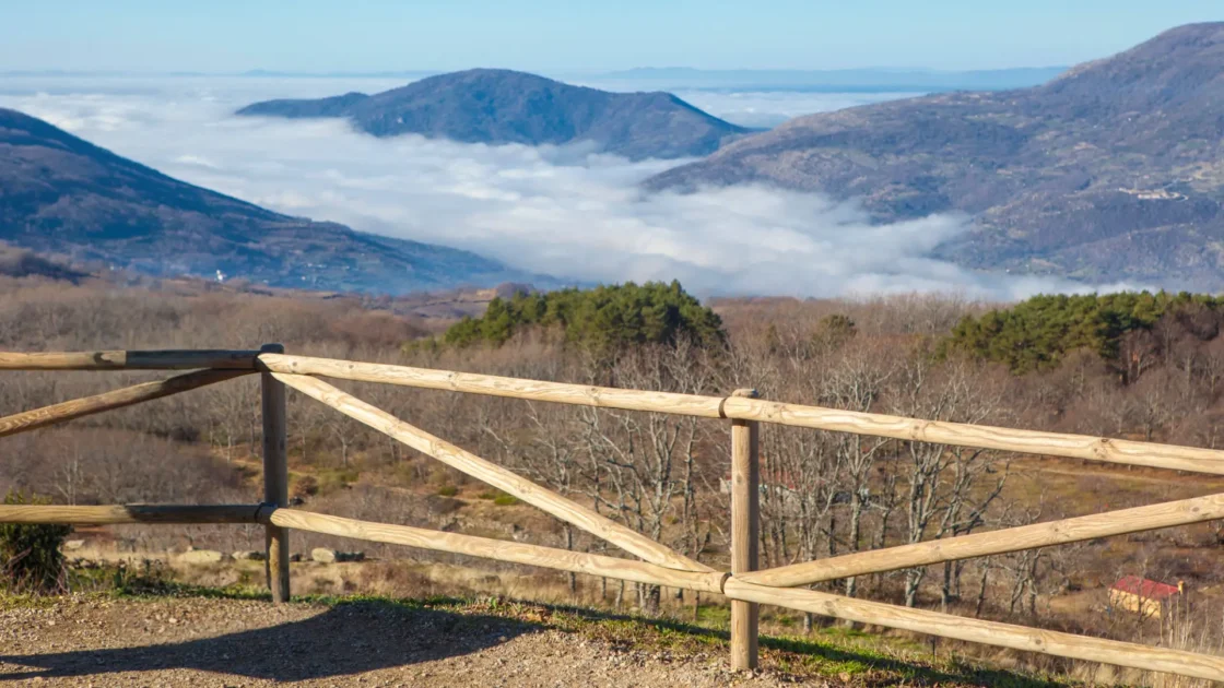 The view over the mist-filled valley from a mountain viewpoint on the Puerto del Piornal, between La Vera and the Jerte Valley, Extremadura, Spain