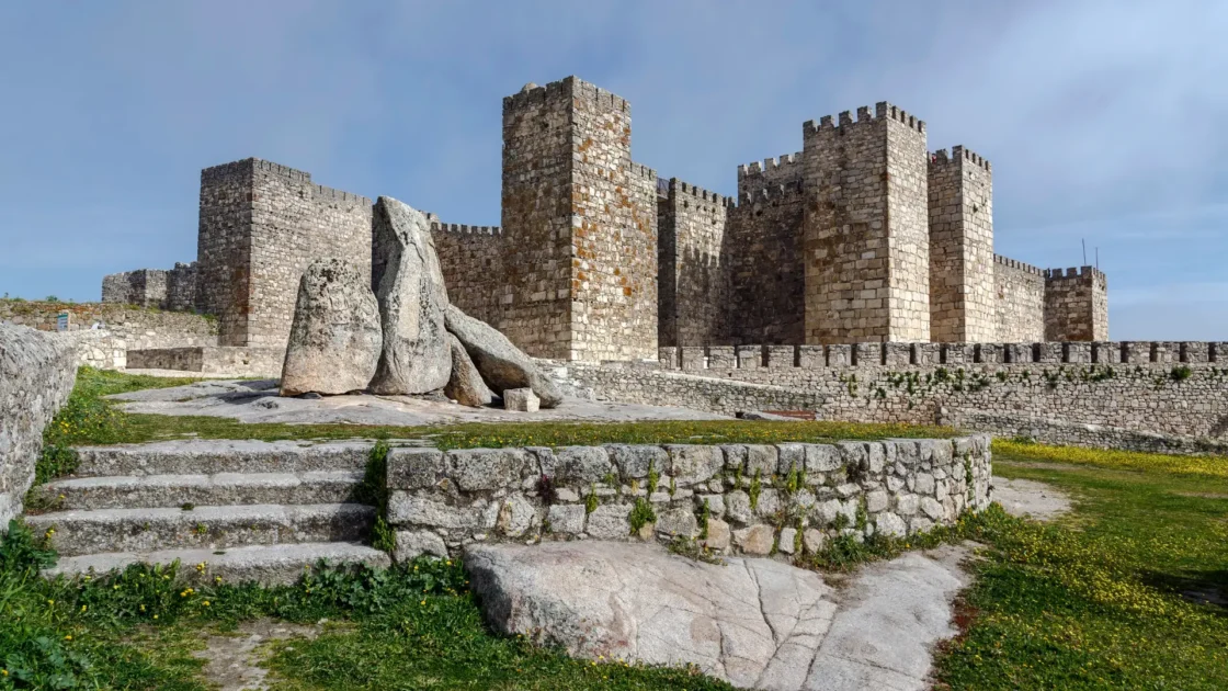 The battlemented walls and towers of Trujillo's Moorish castle above granite boulders, Extremadura, Spain