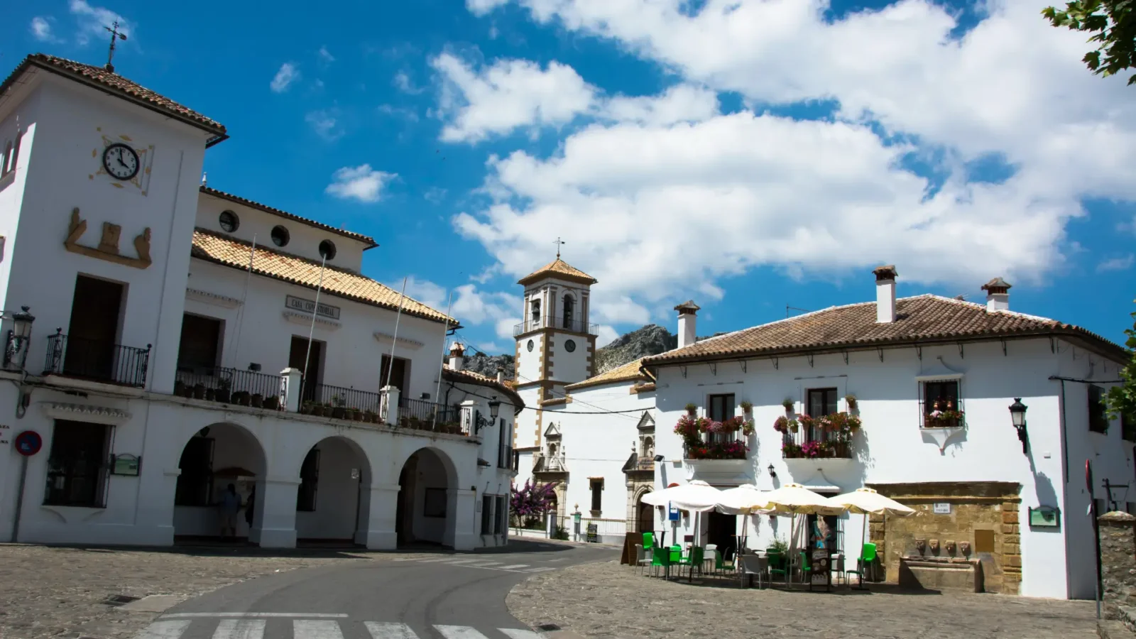 The town hall, church and fountain on the Plaza de España in Grazalema, Andalucía