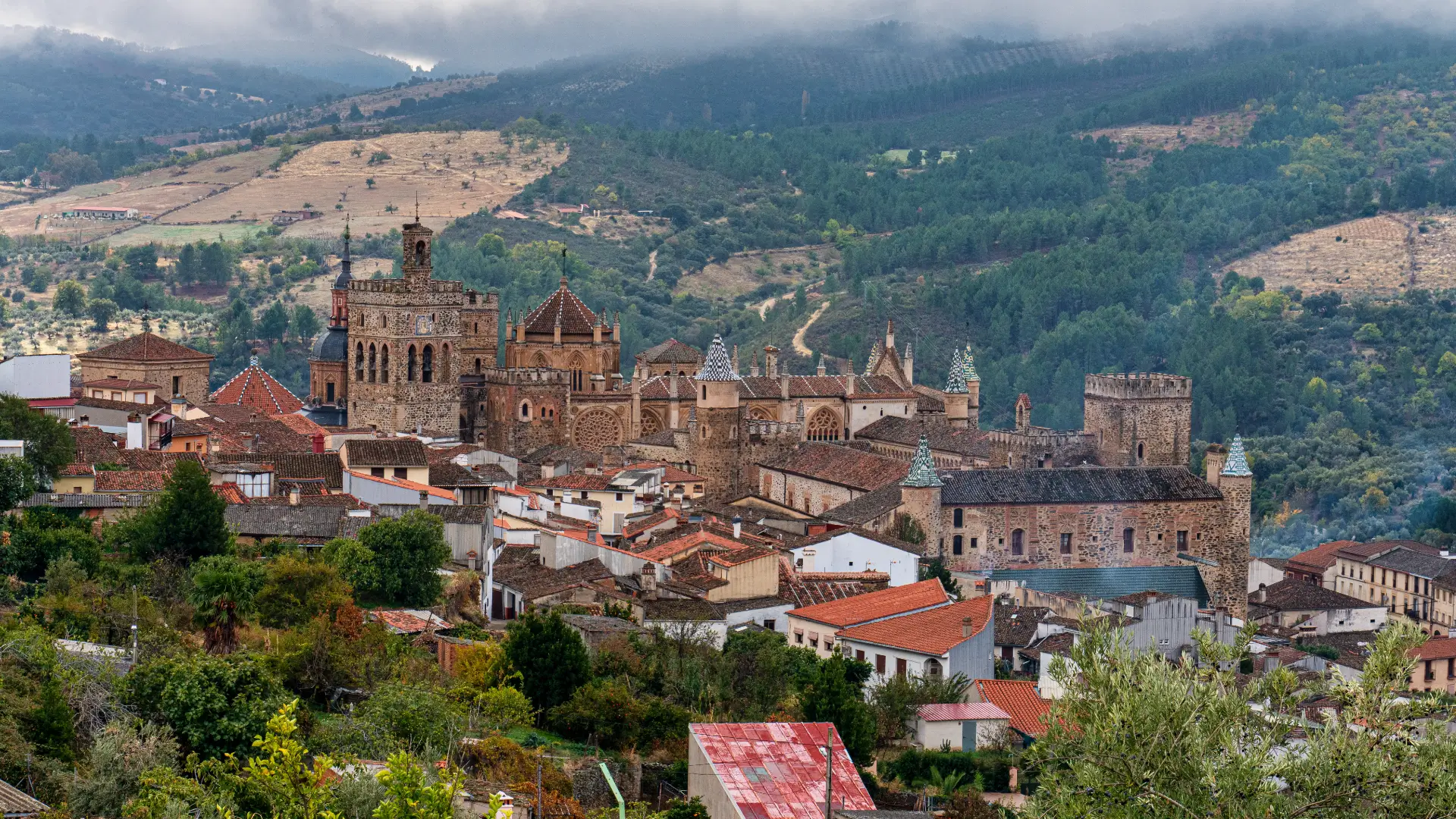 The village of Guadalupe and its monastery set among the misty Villuercas mountains, Extremadura, Spain