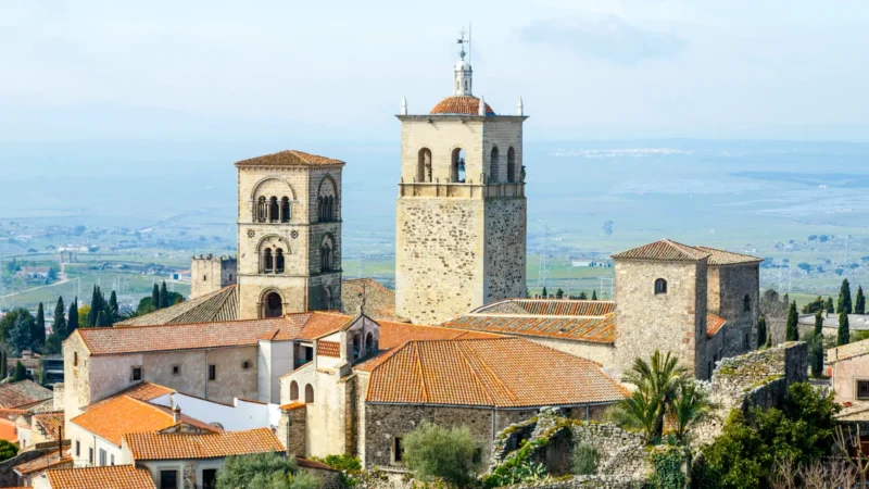 Romanesque-Gothic tower and stone facade of the Iglesia de Santa María la Mayor in Trujillo