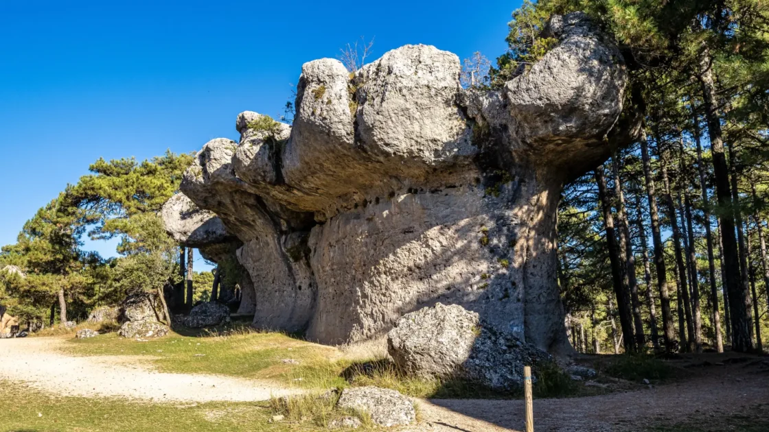 Mushroom-shaped rock formations beside the path at the Ciudad Encantada near Valdecabras, Castilla-La Mancha, Spain