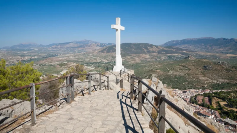 Stone cross viewpoint above the city and olive plain in Jaén, Andalucía, Spain