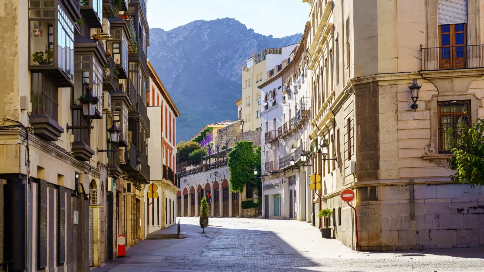 Quiet old-town pedestrian street below the mountains in Jaén, Andalucía, Spain