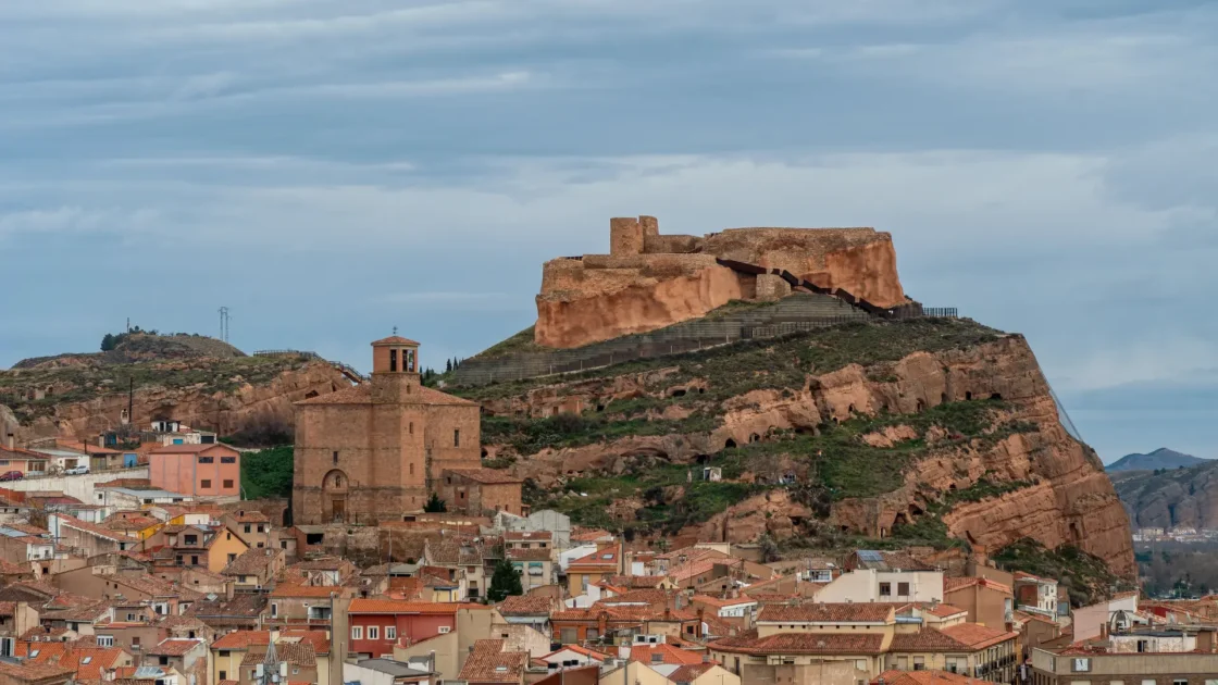 Arnedo below its castle on a red rock hill, La Rioja, Spain