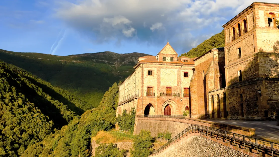 Monastery of Valvanera above a wooded valley, La Rioja, Spain