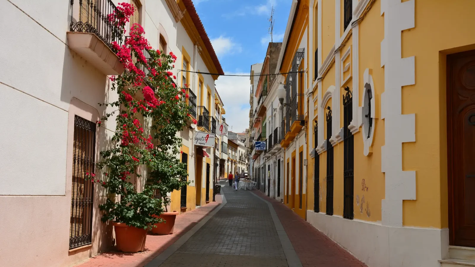 A quiet street with bougainvillea in the old town of Mérida, Extremadura, Spain