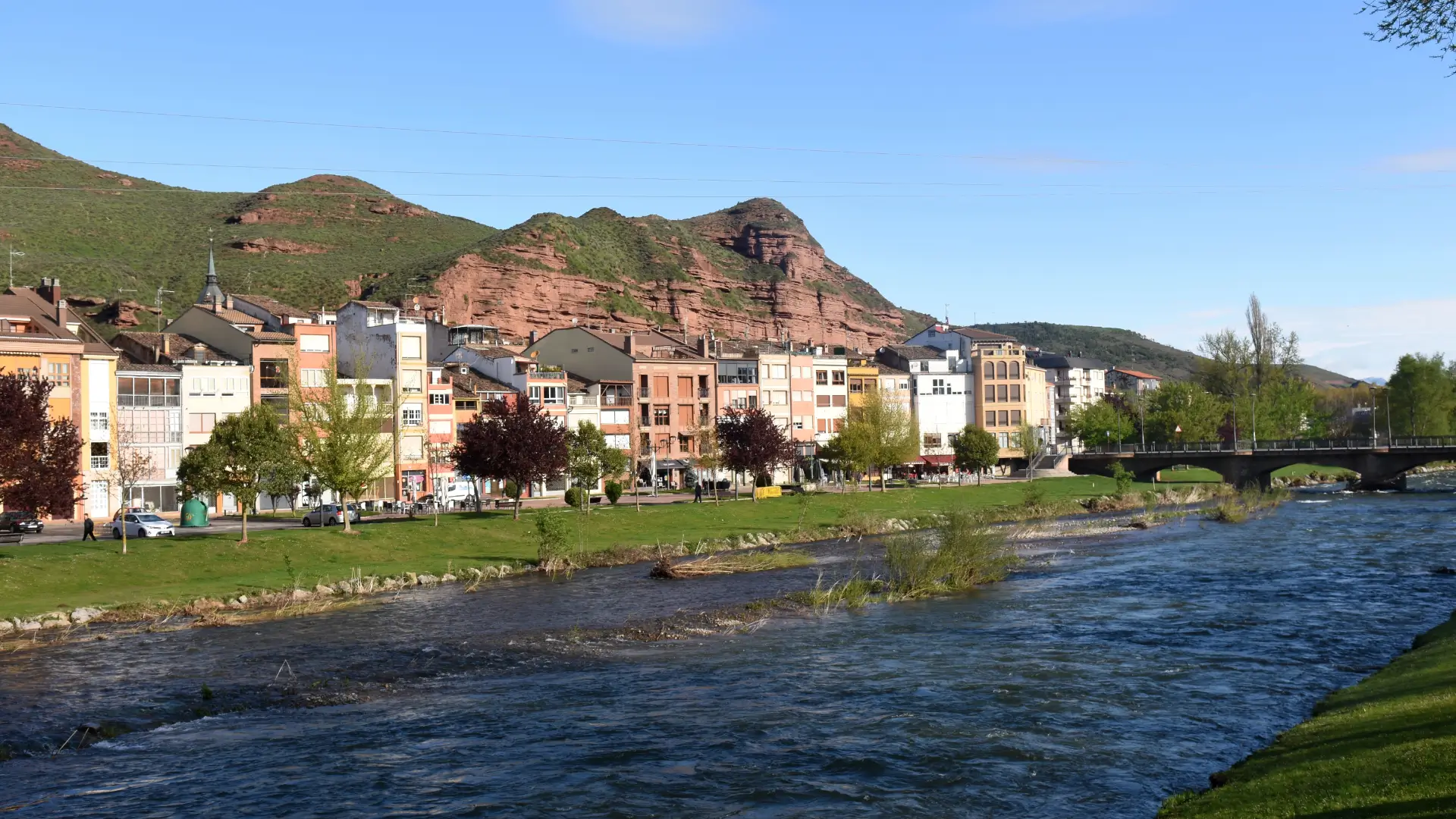 The old town of Nájera along the Najerilla river below its red cliffs, La Rioja, Spain