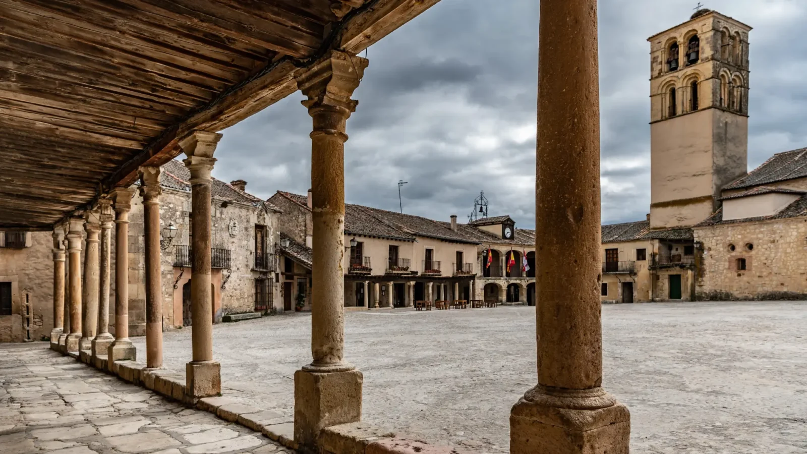 The arcaded Plaza Mayor of Pedraza seen from under the colonnade, Castilla y León, Spain