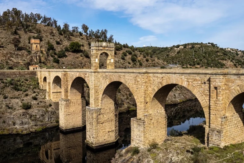 The Roman bridge of Alcántara spanning the River Tagus, with its central triumphal arch, near the Portuguese border