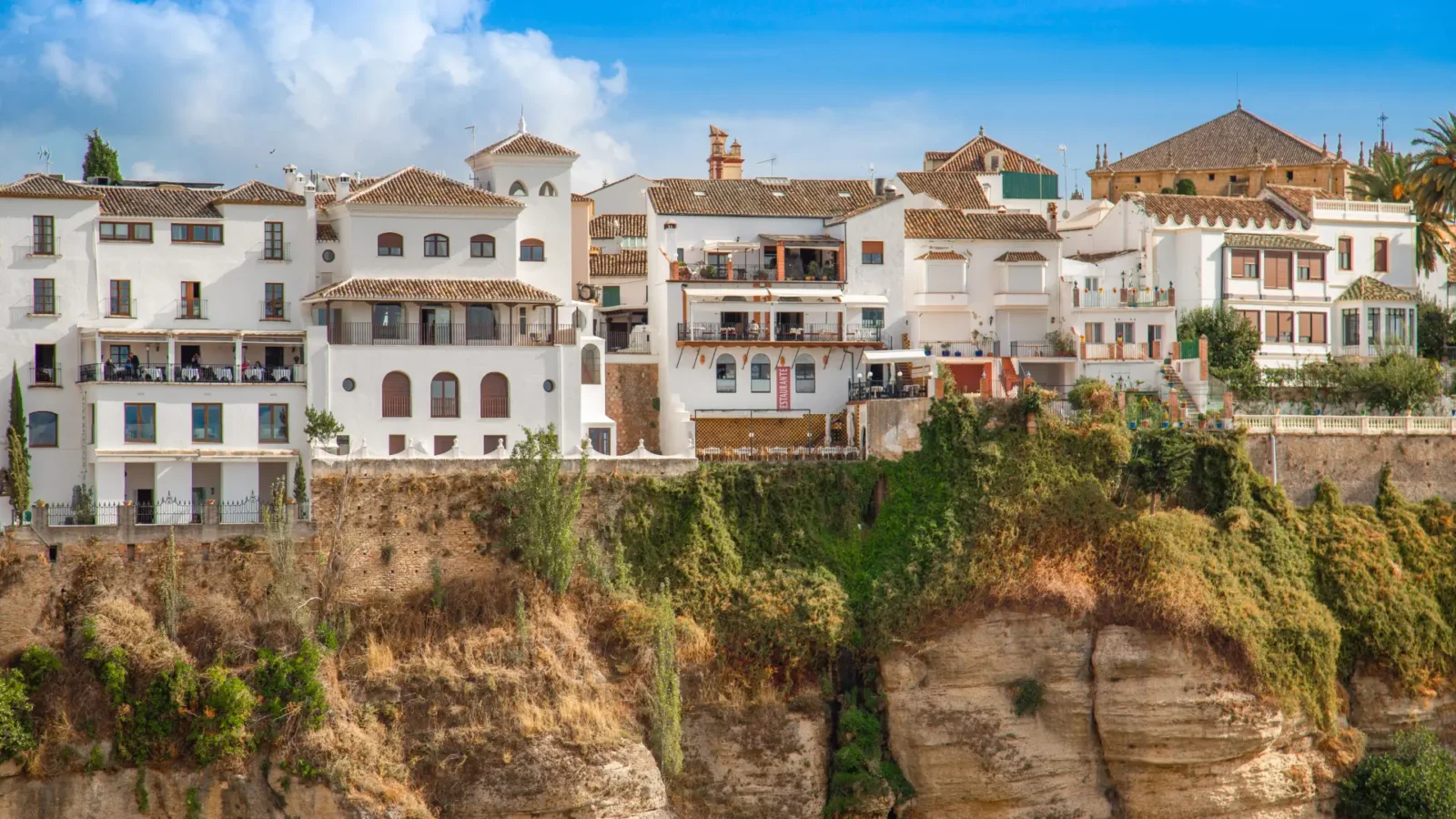 Whitewashed houses with terraces on the cliff edge in Ronda, Málaga, Spain