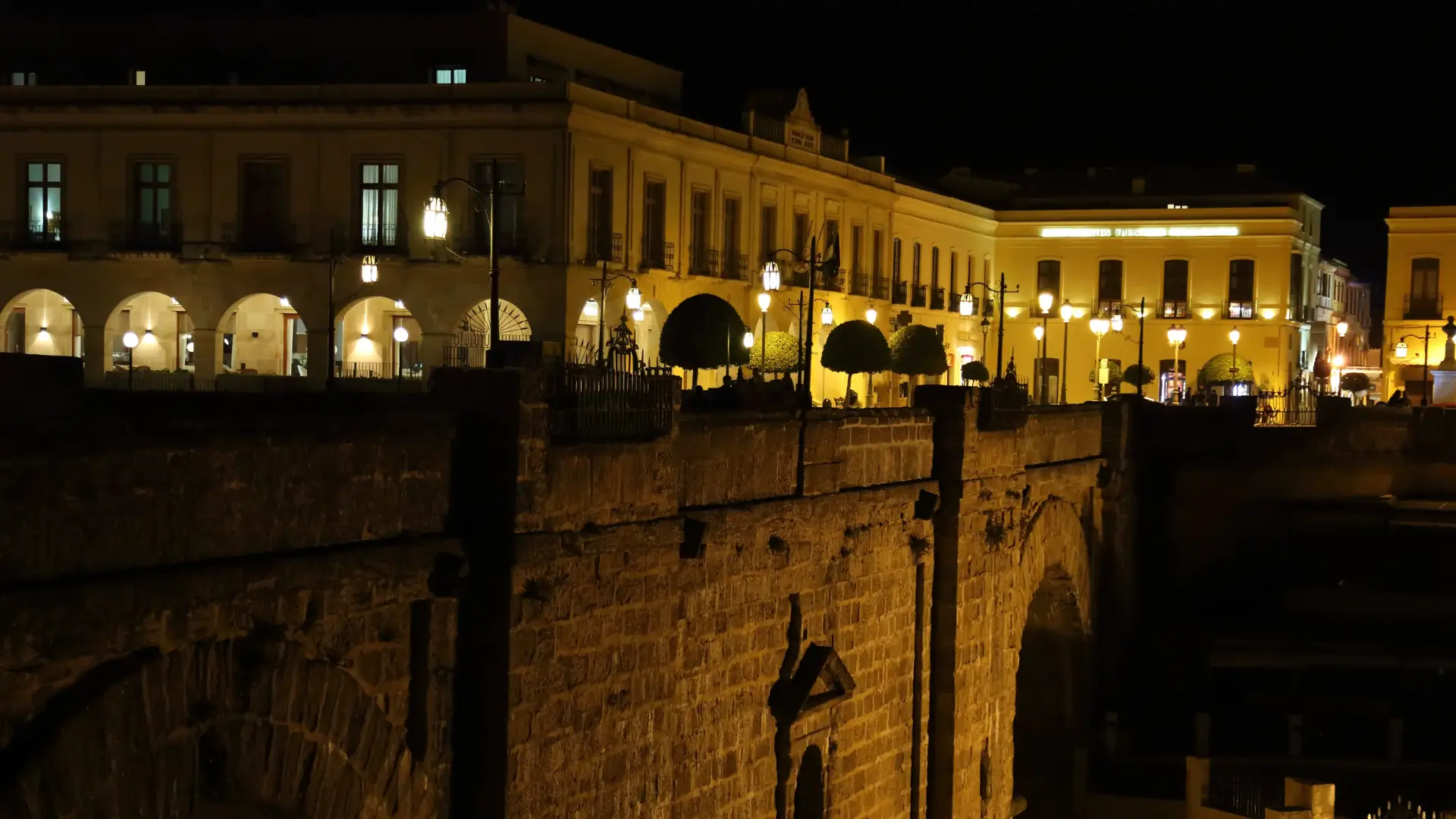 Ronda's illuminated bridge and old town at night, Andalucía, Spain
