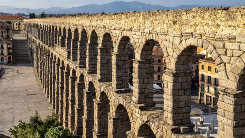 The arches of the Roman aqueduct of Segovia below the sierra, Castilla y León, Spain