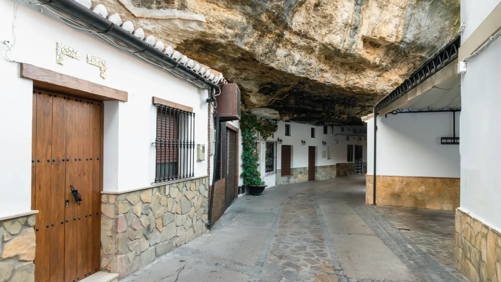 A cave house doorway under the rock in Setenil de las Bodegas, Andalucía, Spain