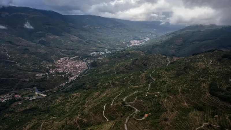 The Jerte Valley seen from above, with a village on the valley floor and terraced slopes, Extremadura, Spain