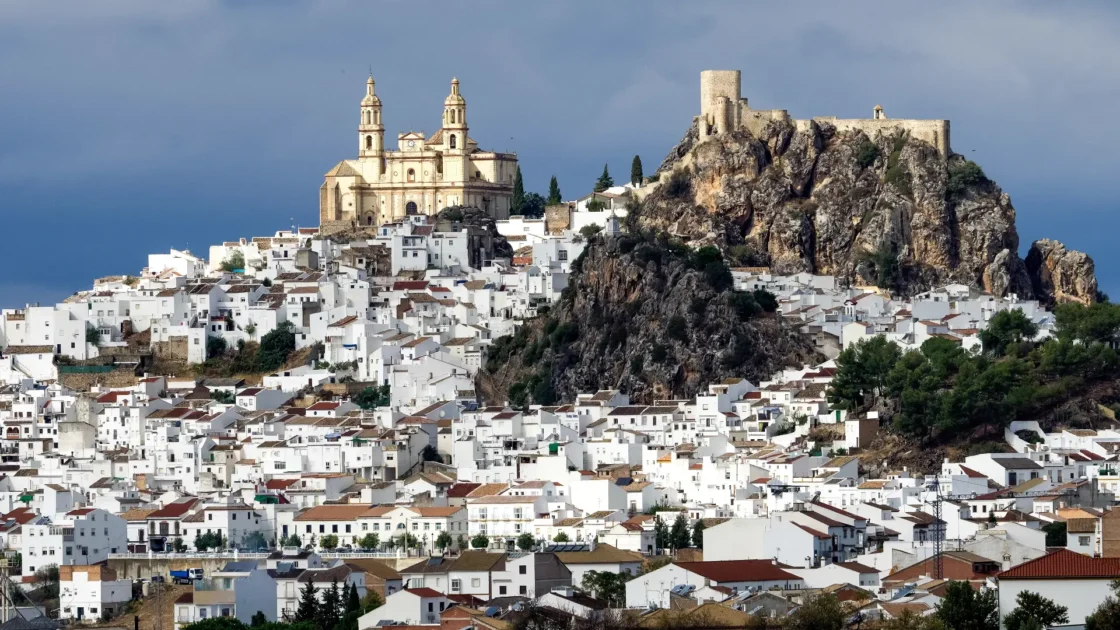 The castle and church crowning the white town of Olvera, Andalucía, Spain