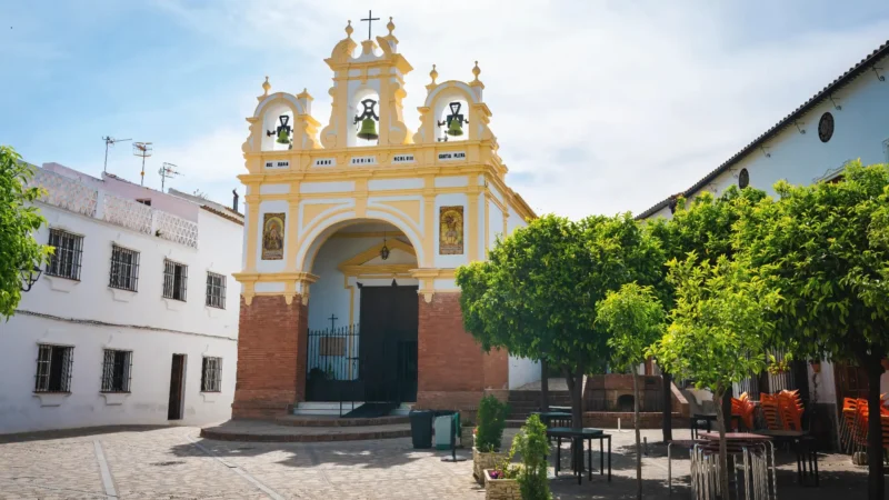 The baroque façade of the Capilla de San Juan de Letrán on its cobbled square, Zahara de la Sierra, Cádiz, Andalucía, Spain